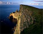 Sheer drop of Da Nort Bank, over 250m, and natural arches, north-west of Foula island, Foula, Shetland Islands, Scotland, United Kingdom, Europe