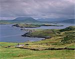 Lighthouse, Beginish Island, Doulus Bay and Knocknadobar in the distance, viewed from Valentia island, Ring of Kerry, County Kerry, Munster, Republic of Ireland, Europe