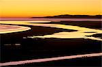 Coucher de soleil sur la baie de Luskentyre, à marée basse, Ouest côte de Sud Harris, Hébrides extérieures, en Écosse, Royaume-Uni, Europe