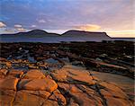 Red sandstone shore, Hoy Island and Hoy Sound from Mainland, Orkney Islands, Scotland, United Kingdom, Europe