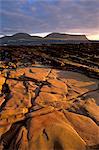 Red sandstone shore, Hoy Island and Hoy Sound from Mainland, Orkney Islands, Scotland, United Kingdom, Europe