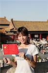 Chinese woman with flag, Forbidden City, Beijing, China, Asia