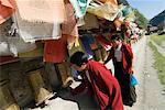 Two women turning prayer wheels, Tagong temple, Tagong, Sichuan, China, Asia