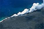 Steam cloud rising where lava from the Pu'u O'o cinder cone far inland enters sea on southeast Puna coast near Kaimu, Big Island, Hawaii, Hawaiian Islands, United States of America, Pacific, North America