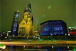 Contrast of the Remembrance Church and the Kaiser Wilhelm Memorial Church, illuminated at night, Kurfurstendam, Berlin, Germany, Europe