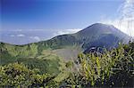 Looking across the old crater towards the smoking 2438m summit of the active volcano Mount Canison, Visayan island of Negros, Philippines, Southeast Asia, Asia