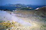 Steam issuing from sulphurous fumarole at Gran Craters, Vulcano Island, with islands of Lipari and Salina beyond, Aeolian Islands (Eolian Islands) (Lipari Islands), UNESCO World Heritage Site, Sicily, Italy, Mediterranean, Europe