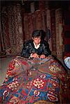 Man repairing carpet at a shop, Side, Anatolia, Turkey, Asia Minor, Eurasia