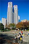 Children play in a park below the New Tokyo City Hall in Shinjuku, Tokyo, Japan, Asia