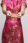 cropped shot of woman in pink cheongsam