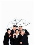 A business group under a clear umbrella