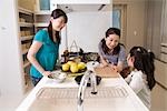 Family cooking in kitchen