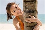 Young woman in bikini smiling