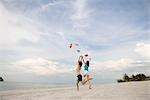 Two young women throwing flip flop