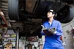 Mechanic checking car