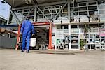 Gas station clerk walking