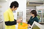 Clerk and customer at convenience store