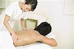 Massage therapist applying thalassotherapy