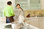 Couple cooking in kitchen