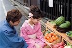 Young couple in kimono shopping