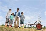 Family standing in field