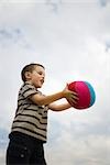 Little boy catching ball