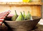 Fresh figs in a wooden bowl