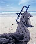 Chair and blue cloth on the beach