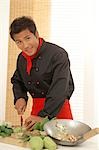 Asian cook is preparing vegetables