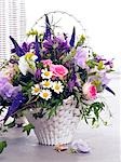 Basket with roses,vetches,veronica,chamomille and columbines