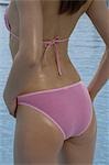 Back view of a woman in a pink bikini
