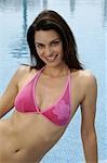 Woman in a pink Bikini at the swimming pool