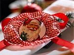 Serviette de table décoré avec une plaquette de Santa Claus