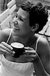 Young woman enjoying a cappuccino