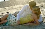 Young couple lying on the beach