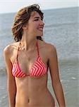 Young woman in a bikini on the beach