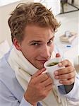 young man having a cup of herb tea