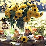Layed table with bunch of sunflowers