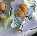 Place setting with rolls and boiled egg
