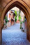 Archway Over Cobblestone Street at Dawn, Dinan, Ille-et-Vilaine, Brittany, France