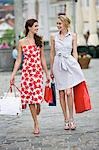 women walking through a shopping street