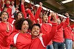 Fans celebrating at at football match