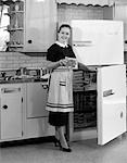 1950s WOMAN KITCHEN REFRIGERATOR