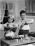 1950s TWO CHILDREN PLAYING PRETENDING DOCTOR NURSE HOSPITAL