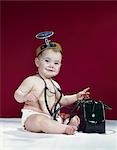 1960s BABY AS MEDICAL DOCTOR WITH BLACK BAG WEARING STETHOSCOPE & OPTHALMOSCOPE