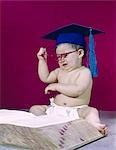 1960s GRADUATE PROFESSOR BABY WEARING ACADEMIC CAP MORTARBOARD EYEGLASSES READING BOOK DICTIONARY ANGRY FRUSTRATED