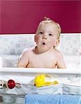 1960s BABY IN LAYETTE BATH MAKING FUNNY FACE