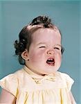 1950s 1960s UNHAPPY CRYING BABY MOUTH OPEN SHOWING NEW TEETH TEETHING PAIN