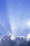 GOD LIKE SUN RAYS AT TOP OF CLOUD FORMATION BLUE SKY