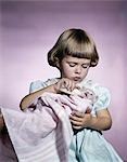 1950s 1960s LITTLE GIRL FEEDING KITTEN WITH A BABY BOTTLE OF MILK STUDIO